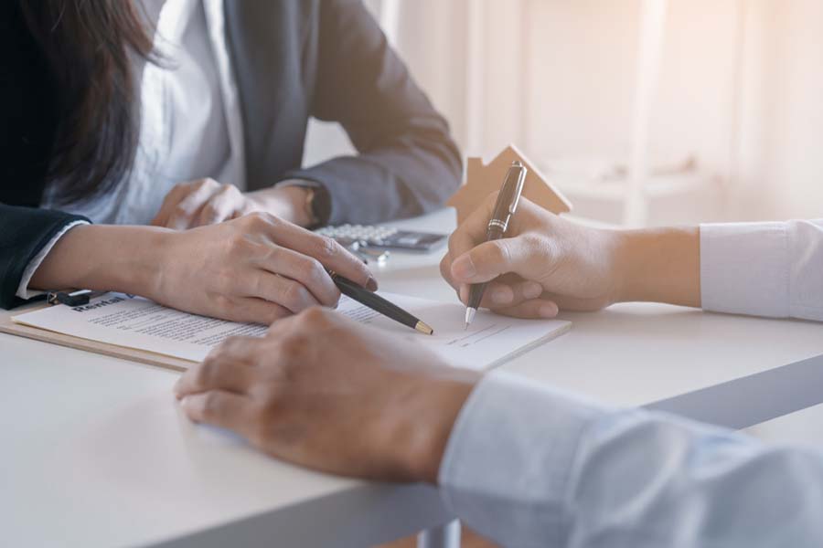 Salesmen Signing A Contract